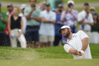 Scottie Scheffler hits from the bunker on the fifth hole during the first round of the PGA Championship golf tournament at the Valhalla Golf Club, Thursday, May 16, 2024, in Louisville, Ky. (AP Photo/Matt York)