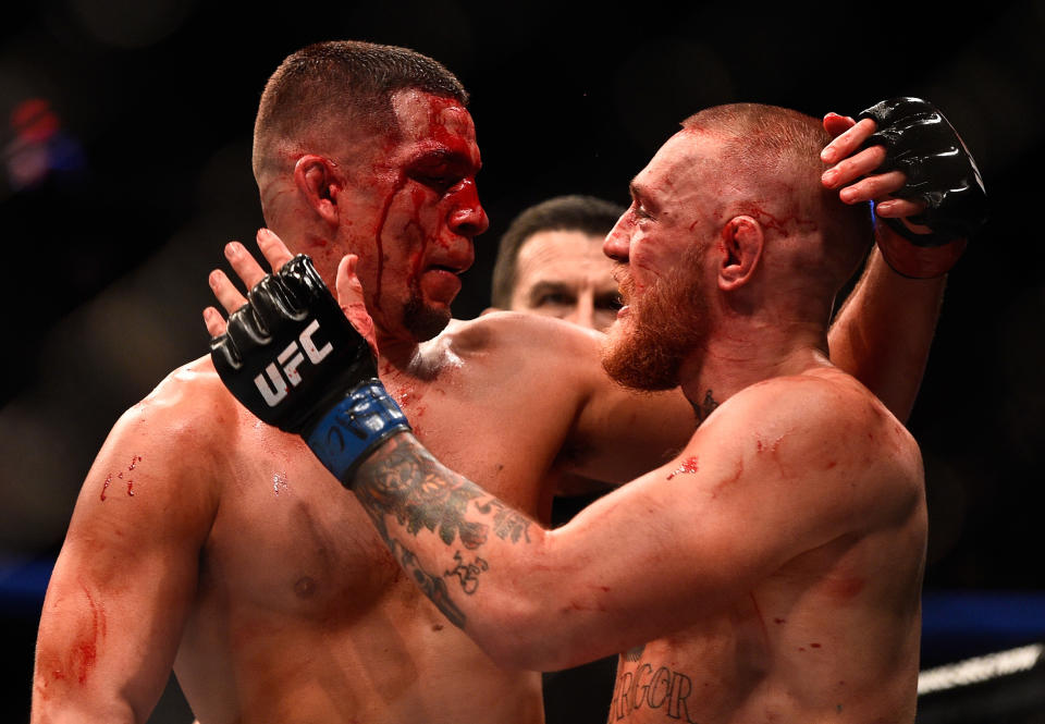 LAS VEGAS, NV - AUGUST 20:  (L-R) Nate Diaz and Conor McGregor of Ireland embrace after finishing five rounds in their welterweight bout during the UFC 202 event at T-Mobile Arena on August 20, 2016 in Las Vegas, Nevada. (Photo by Jeff Bottari/Zuffa LLC/Zuffa LLC via Getty Images)