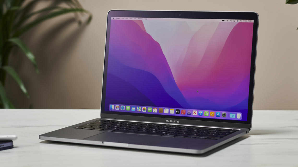  The 13-inch MacBook Pro 2022 open and facing forwards on a table 