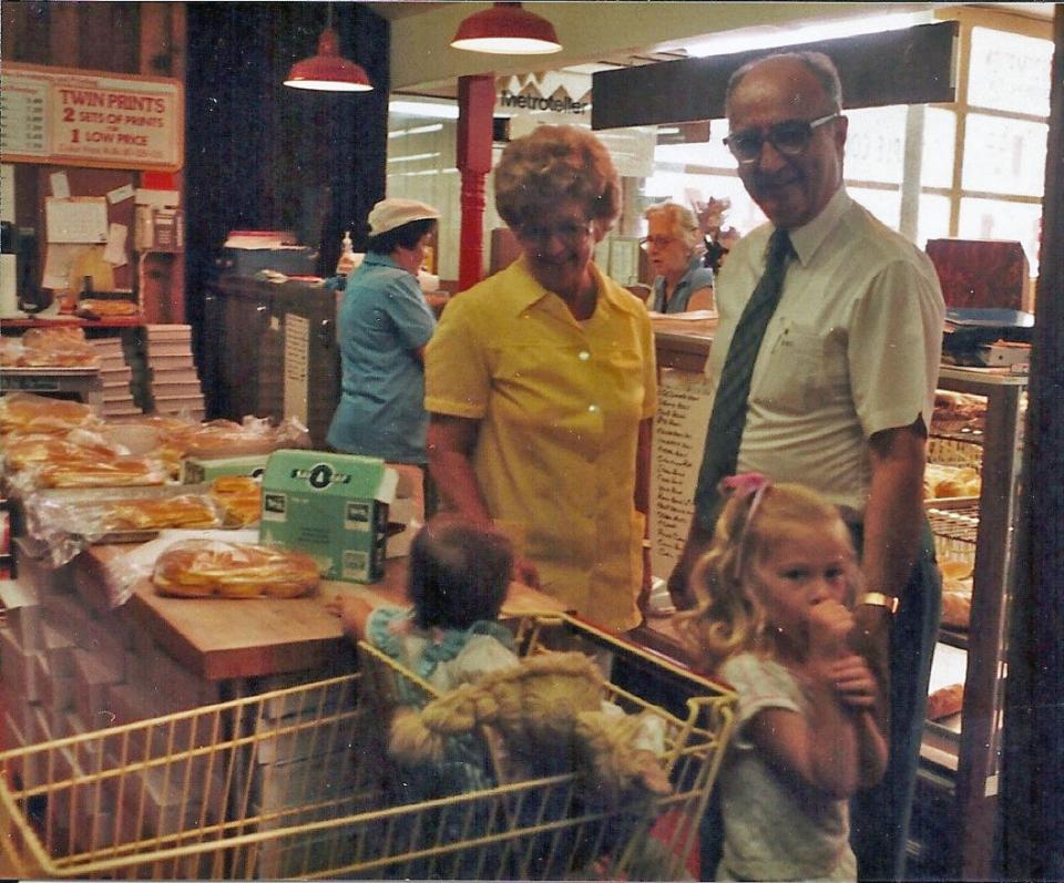 Franklin and Elaine Shank take a break from running their Towne & Country Supermarket on Jefferson Boulevard in Hagerstown to spend some time with their granddaughters Karen Rohrer, in cart, and Amy Rohrer in this 1987 photo.