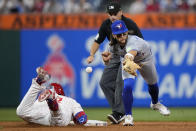 Philadelphia Phillies' Kyle Schwarber, left, slides into second base for a double past Toronto Blue Jays shortstop Bo Bichette during the eighth inning of a baseball game, Tuesday, May 7, 2024, in Philadelphia. (AP Photo/Matt Slocum)