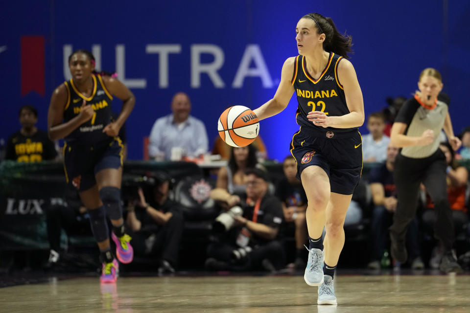 UNCASVILLE, CONNECTICUT - SEPTEMBER 22: Caitlin Clark #22 of the Indiana Fever advances the ball during the second half of a first round WNBA playoff game against the Connecticut Sun at Mohegan Sun Arena on September 22, 2024 in Uncasville, Connecticut. The Sun defeated the Fever 93-69. NOTE TO USER: User expressly acknowledges and agrees that by downloading and/or using this photo, user agrees to the terms and conditions of the Getty Images License Agreement. (Photo by Joe Buglewicz/Getty Images)