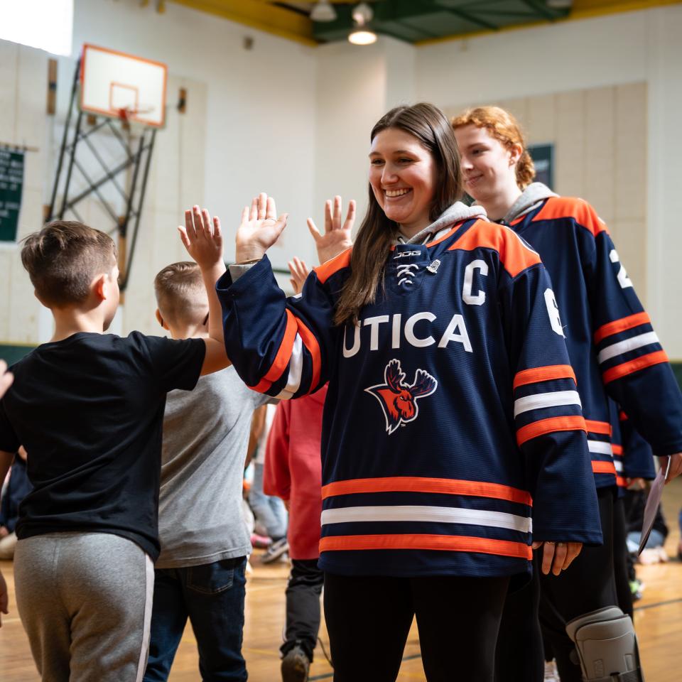 Erica Sloan and her Utica University women's hockey teammates greet the students at Westmoreland Upper Elementary School on Tuesday, February 27, 2024.