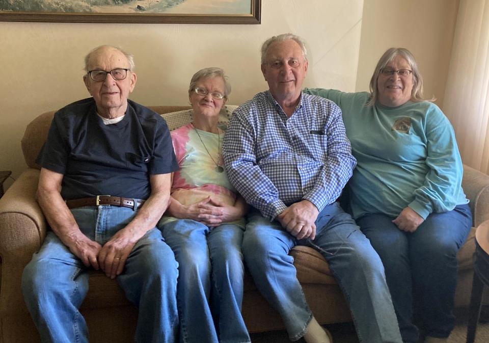 Florian "Larry" Ozimek, left, who will be 105 on May 28, sits on a souch with his three surviving children, from left to right: Joan Ozimek, 80; Richard Ozimek, 79; and Patty Cummings, 68. Larry Ozimek helps care for Joan Ozimek, who suffered vision and developmental issues after a childhood bout of encephalitis.