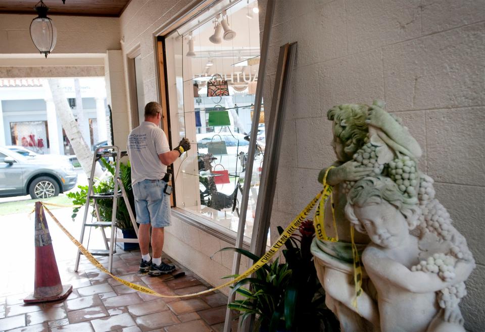 The window of Only Authentics is replaced in December following a smash-and-grab robbery.