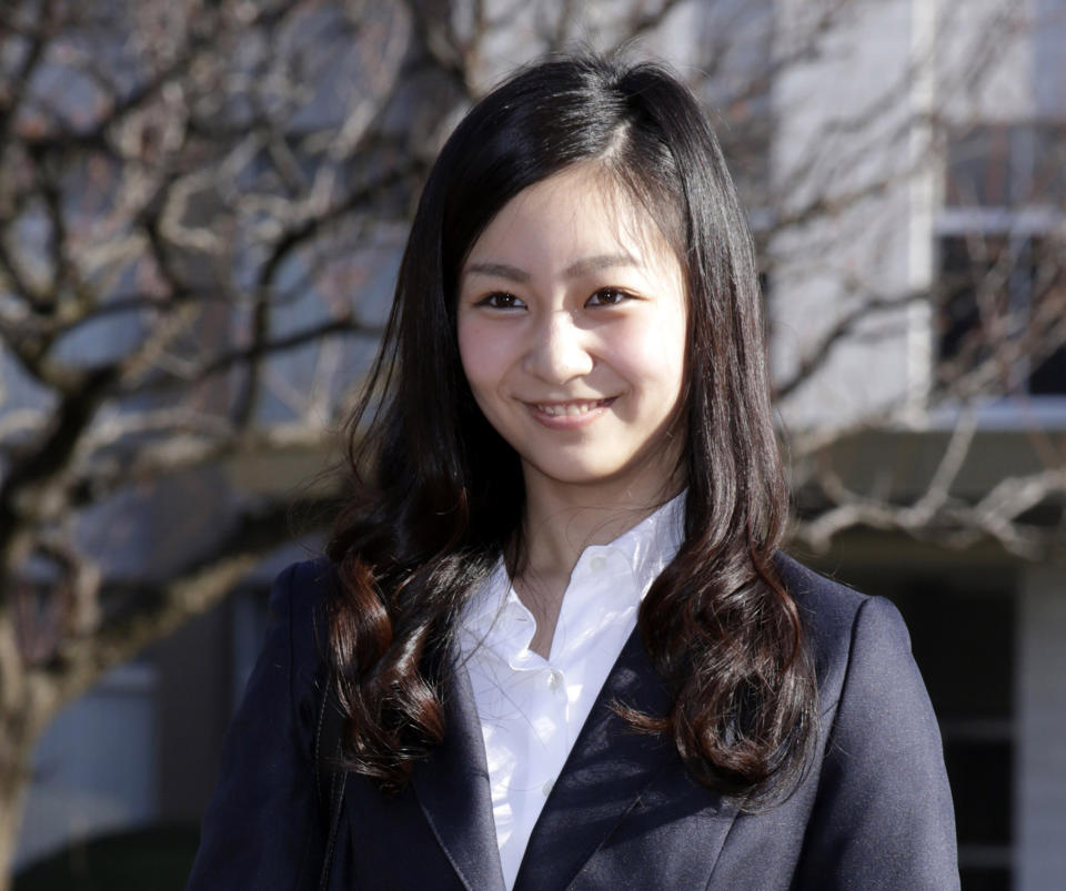 FILE - In this April 2, 2015, file photo, Japan's Princess Kako, younger daughter of Prince Akishino and Princess Kiko, poses on the campus of International Christian University prior to the entrance ceremony of the university in Tokyo. Japan’s Emperor Akihito, abdicating Tuesday, April 30, 2019, has a relatively small family, and it will shrink in coming years. (AP Photo/Eugene Hoshiko, File)