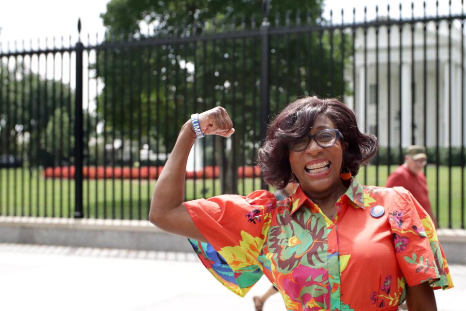 Paula Chambers Raney smiles in front of the White House during her advocacy work.