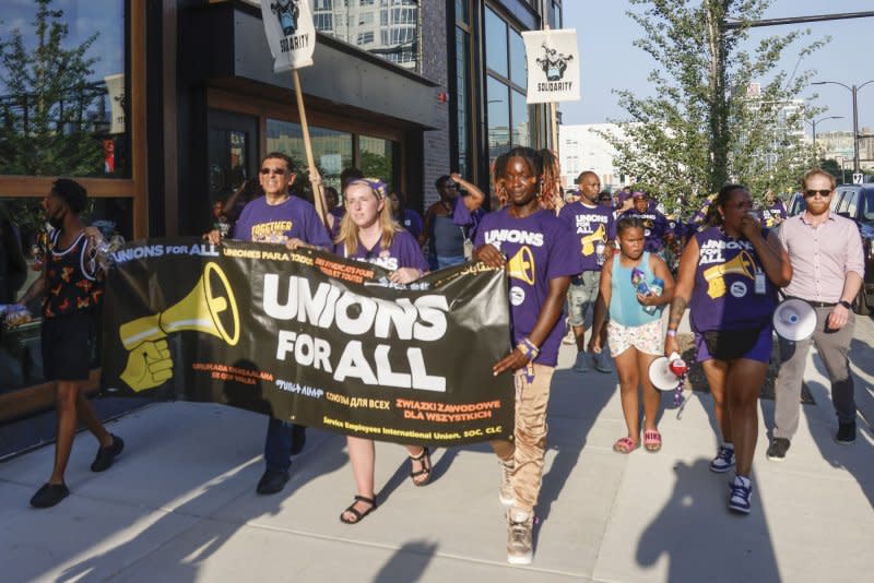 People protest at the first Republican presidential candidate debate at Fiserv Forum in Milwaukee, Wisc., on Wednesday. Photo by Tannen Maury/UPI