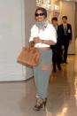 <p>Janet Jackson wears sweatpants with (what else?) high heel boots as she makes her way through the airport in Narita, Japan in October 2006. </p>