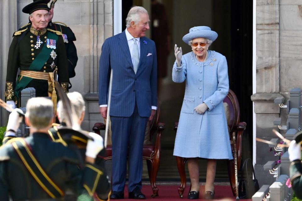 Prince Charles, Prince of Wales and Queen Elizabeth II attend the Royal Company of Archers Reddendo Parade in the gardens of the Palace of Holyroodhouse