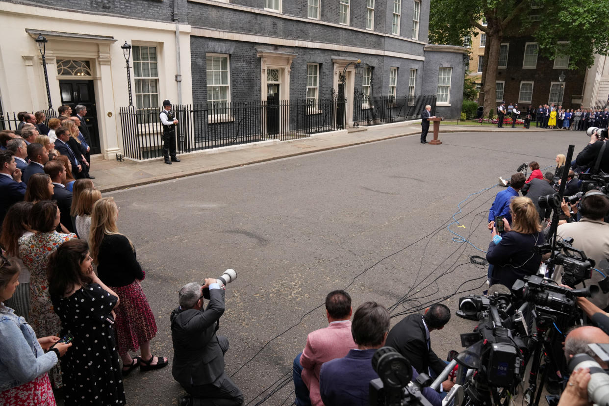 British Prime Minister Boris Johnson reads a statement at No. 10 Downing St. in London.