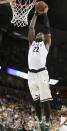 Michigan State’s Branden Dawson (22) dunks in the first half during the third-round game of the NCAA men's college basketball tournament against Harvard in Spokane, Wash., Saturday, March 22, 2014. (AP Photo/Young Kwak)