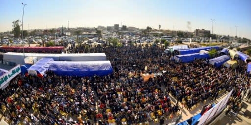 Protesters gather outside Kufa University in central Iraq on Sunday