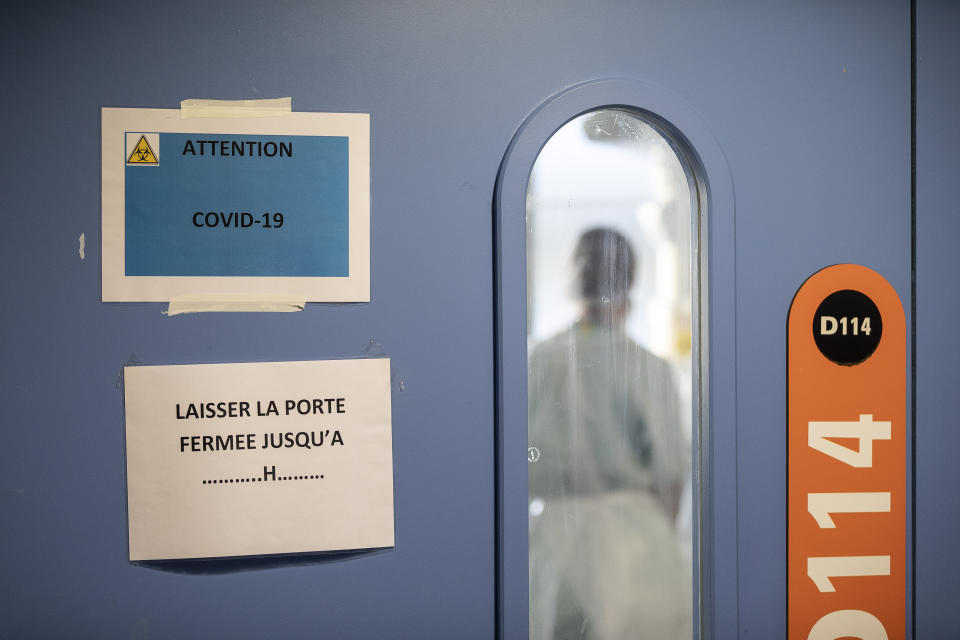 A nurse is seen in a COVID-19 area of the Nouvel Hospital Civil of Strasbourg, Eastern France, Tuesday, Sept.15, 2020. France is grappling with the double headache of trying revive its COVID-battered economy while also curbing the steady climb in infections spread during summer months when vacationers let their guard down and picked up by increased testing. (AP Photo/Jean-Francois Badias)