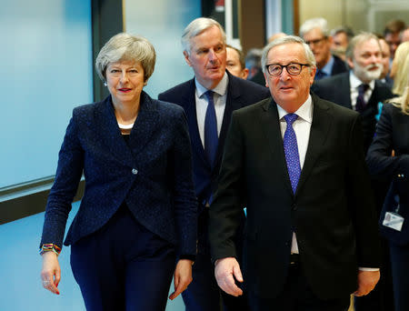 European Commission President Jean-Claude Juncker walks with British Prime Minister Theresa May at the European Commission headquarters in Brussels, Belgium February 7, 2019. REUTERS/Francois Lenoir