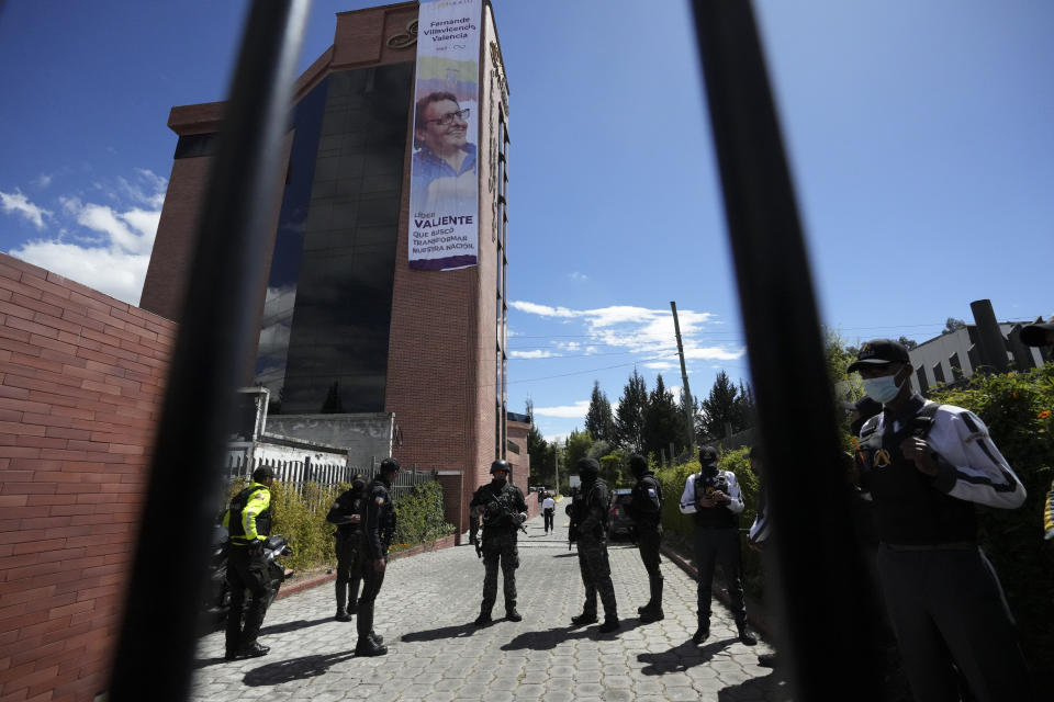 Security officers stand inside the cemetery during the funeral of slain presidential candidate Fernando Villavicencio in Quito, Ecuador, Friday, Aug. 11, 2023. The 59-year-old was fatally shot at a political rally on Aug. 9 in Quito. (AP Photo/Dolores Ochoa)