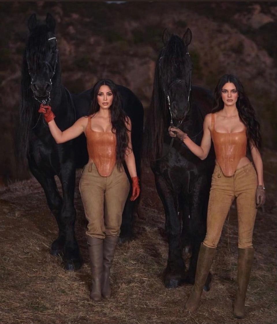 Kim Kardashian and Kendall Jenner with two Friesian horses from Four Legs on Set