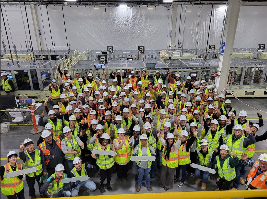 Ultium Cells staff gathers after completing its first shipment of batteries to General Motors in Spring Hill, culminating in two-and-a-half years of work since the plant's groundbreaking.