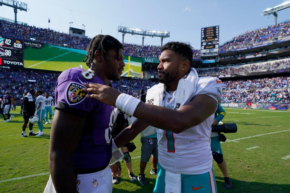 Ravens QB Lamar Jackson and Dolphins QB Tua Tagovailoa greet one another after last year's 42-38 Miami win in Baltimore.