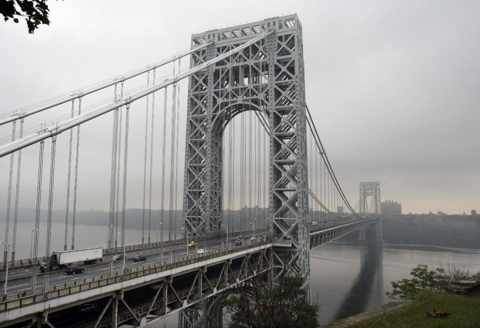 In a Monday, Sept. 2, 2013 photo, traffic moves across the George Washington Bridge, in Fort Lee, N.J. A top aide to New Jersey Gov. Chris Christie is linked through emails and text messages to a seemingly deliberate plan to create traffic gridlock in a town at the base of the bridge after its mayor refused to endorse Christie for re-election. "Time for some traffic problems in Fort Lee," Christie aide Bridget Anne Kelly wrote in an Aug. 13 email to David Wildstein, a top political appointee at the Port Authority of New York and New Jersey, which runs the George Washington Bridge connecting New Jersey and New York City. (AP Photo/Mel Evans)