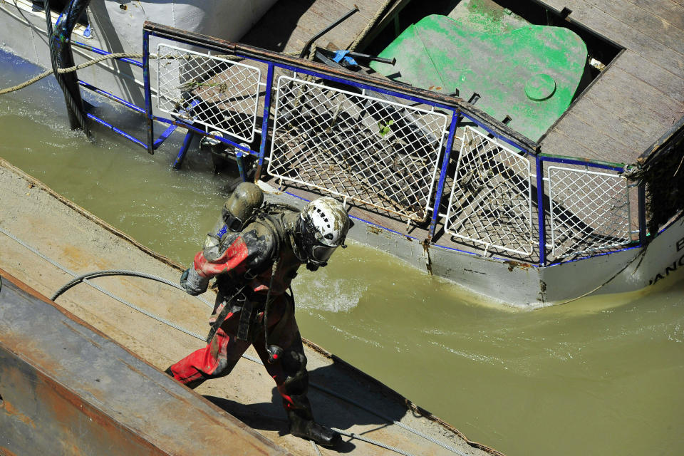 Sludge covers a diver's equipment during the recovery operation of the sunk shipwreck at Margaret Bridge, the scene of the fatal boat accident in Budapest, Hungary, Tuesday, June 11, 2019. The Hableany sightseeing boat carrying 33 South Korean tourists and two Hungarian staff was crashed by a large river cruise ship and sank in the River Danube on May 29. Seven tourists survived, twenty people died, eight persons are still missing. (Peter Lakatos/MTI via AP)