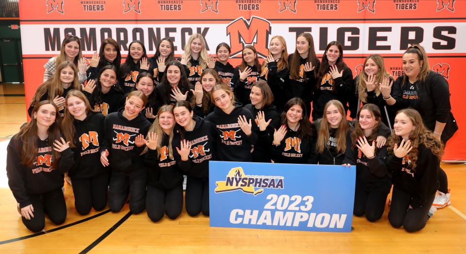 Championship field hockey players show off their rings while posing for a team photo, as Mamaroneck High School held a championship ring ceremony at the school Jan. 12, 2024, to celebrate their 2023 New York State Championship where they defeated Orchard Park, 4-0 on Nov. 12, 2023.