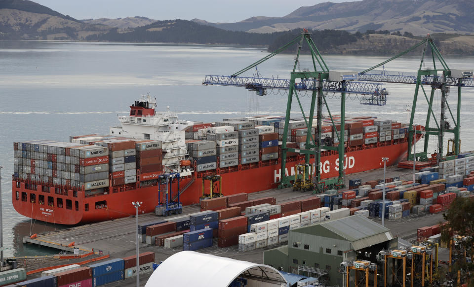 Containers are loaded onto a ship for export at Lyttelton Port near Christchurch, New Zealand, Wednesday, June 3, 2020. New Zealand is hosting this year's Asia-Pacific Economic Cooperation (APEC) forum, which culminates in a leader's meeting on Saturday, Nov. 13, 2021. Continued outbreaks of the coronavirus and related travel restrictions have confined the meeting to the virtual realm for a second straight year. (AP Photo/Mark Baker)