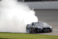 Kevin Harvick celebrates after winning a NASCAR Cup Series auto race at Michigan International Speedway in Brooklyn, Mich., Sunday, Aug. 11, 2019. (AP Photo/Paul Sancya)