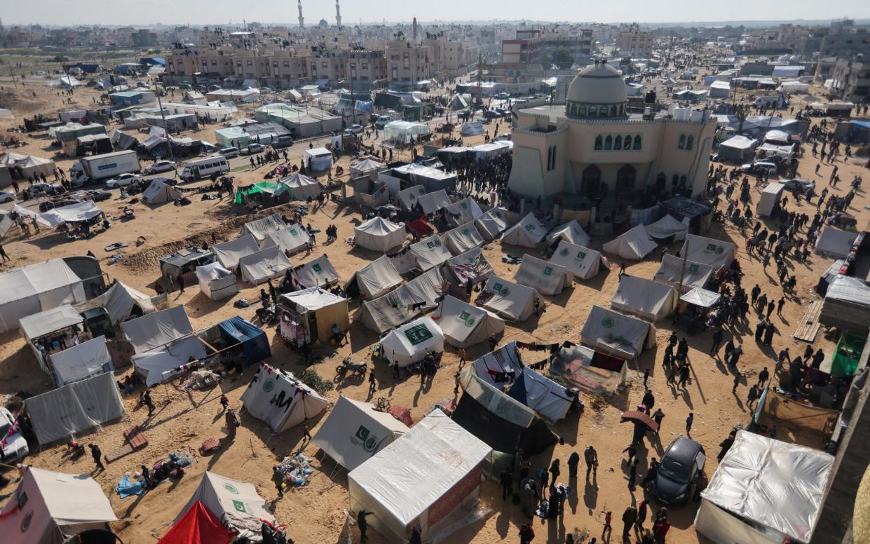 Displaced Palestinians, who fled their houses due to Israeli strikes, shelter in a camp in Rafah, amid the ongoing conflict between Israel and Hamas, in the southern Gaza Strip.