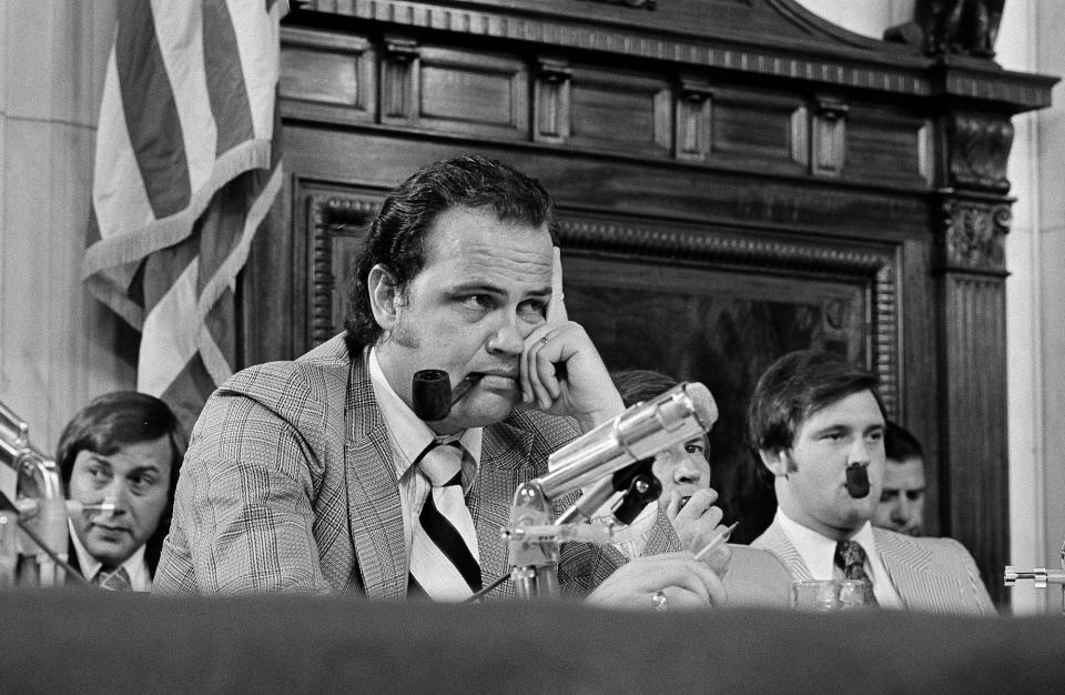 <p>Sen. Fred Thompson, center, listens to questions during the Senate Watergate Committee in Washington, July 11, 1973. Others are unidentified. Barely aware of Watergate when he took the job, Thompson wound up being the one who publicly asked Nixon aide Alexander Butterfield whether there were any listening devices in the White House. (Photo: AP) </p>