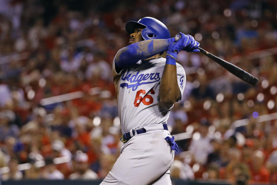 Yasiel Puig helped the Los Angeles Dodgers pull even with the St. Louis Cardinals for the NL's second Wild Card with two homers Friday night. (AP)