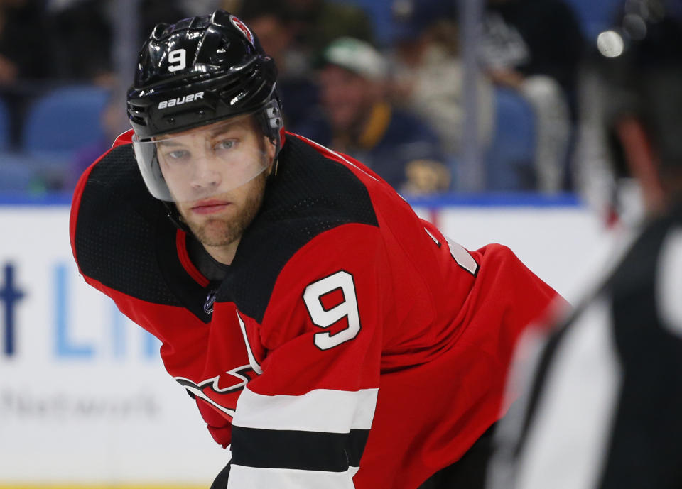 FILE - In this Dec. 2, 2019 file photo New Jersey Devils forward Taylor Hall (9) looks on during the third period of an NHL hockey game against the Buffalo Sabres in Buffalo, N.Y. The Arizona Coyotes have acquired Taylor Hall from the Devils for three prospects and two draft picks, Monday, Dec. 16, 2019. (AP Photo/Jeffrey T. Barnes)