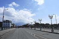 A view of deserted street is seen during a one-day nationwide Janata (civil) curfew imposed as a preventive measure against the COVID-19 coronavirus, in Srinagar on March 22, 2020. - Nearly one billion people around the world were confined to their homes, as the coronavirus death toll crossed 13,000 and factories were shut in worst-hit Italy after another single-day fatalities record. (Photo by Tauseef MUSTAFA / AFP) (Photo by TAUSEEF MUSTAFA/AFP via Getty Images)