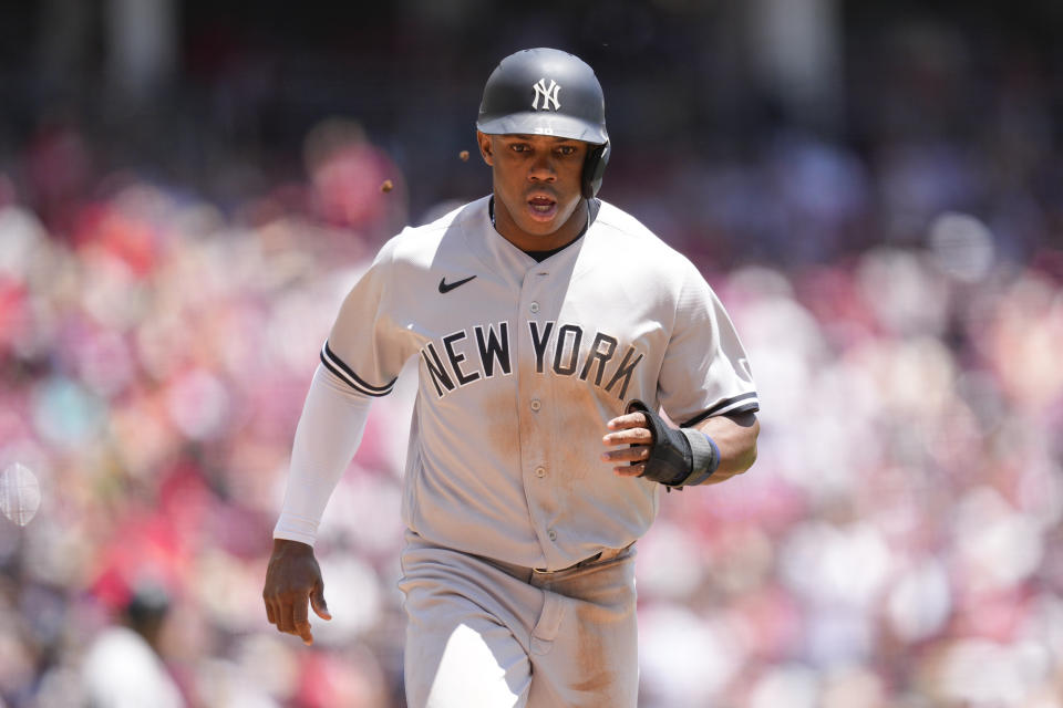 New York Yankees' Greg Allen scores on a double hit by Anthony Volpe in the seventh inning of a baseball game against the Cincinnati Reds in Cincinnati, Sunday, May 21, 2023. (AP Photo/Jeff Dean)