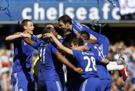 Chelsea's Cesc Fabregas (R) and teammates celebrate after their Premier League match against Crystal Palace at Stamford Bridge on May 3, 2015