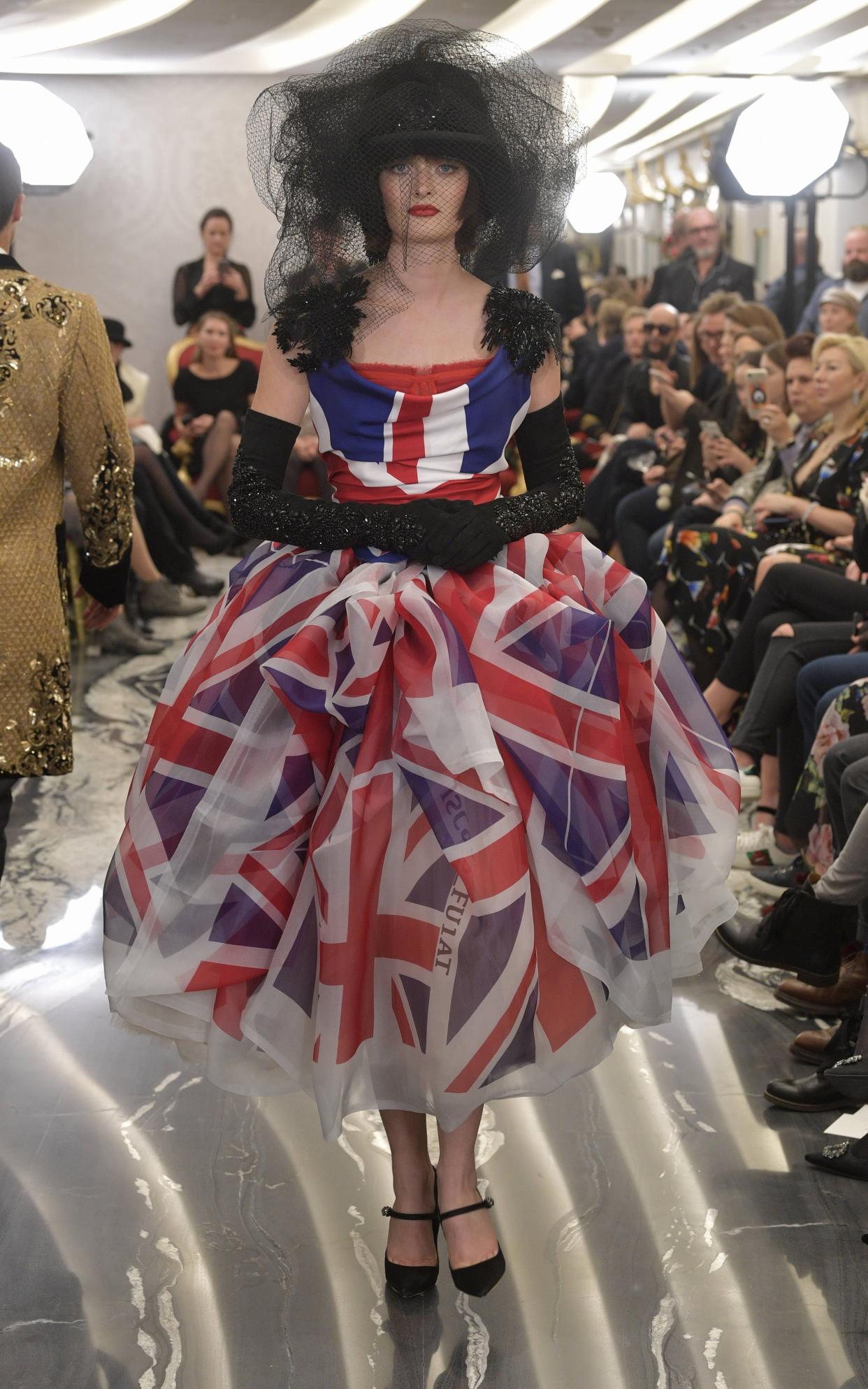 Sam Rollinson in a union flag dress at the Dolce and Gabbana Alta Moday show in London - Dolce & Gabbana