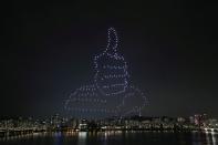 Drones fly over the Han river showing messages to support the country as measures to avoid the spread of the coronavirus disease (COVID-19) continue in Seoul