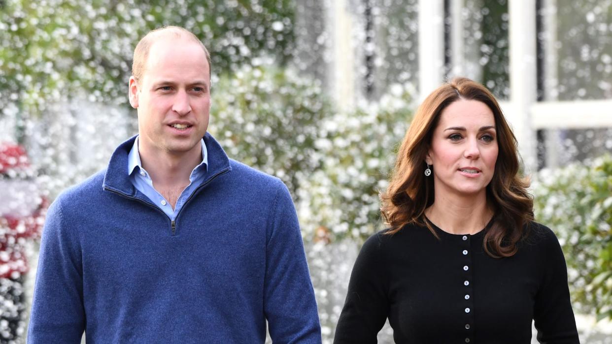 Prince William and Kate walking whilst fake snow falls around them