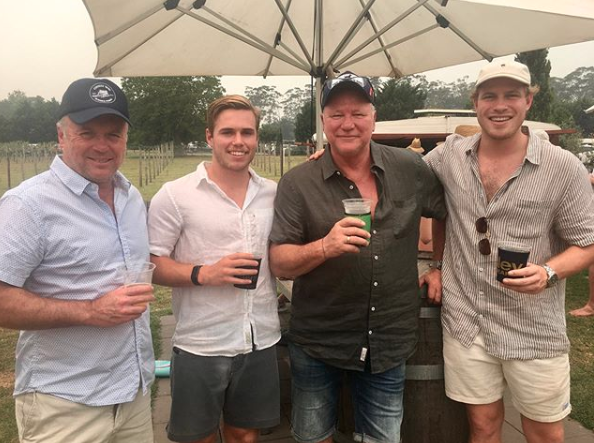 Scott Cam with his sons having a beer