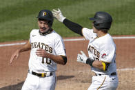 Pittsburgh Pirates' Bryan Reynolds (10) is greeted by John Ryan Murphy after he scored from second with the game winning run against the Minnesota Twins on a single by Kevin Newman in the ninth inning of a baseball game, Thursday, Aug. 6, 2020, in Pittsburgh. The Pirates won 6-5. (AP Photo/Keith Srakocic)
