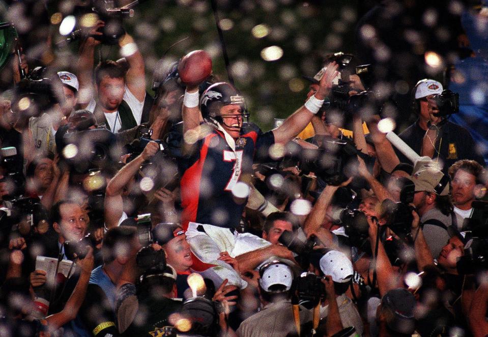 Denver Broncos quarterback John Elway celebrates his team's victory over the Green Bay Packers in Super Bowl XXXII January 25, 1998 in San Diego, Calif.