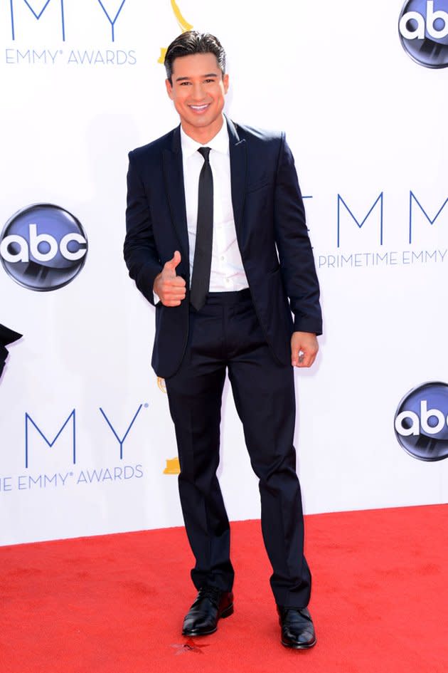Mario Lopez was dapper in a perfectly-tailored navy suit and skinny tie. The “Extra” host completed his look with a big smile that allowed him to show off his signature dimples.