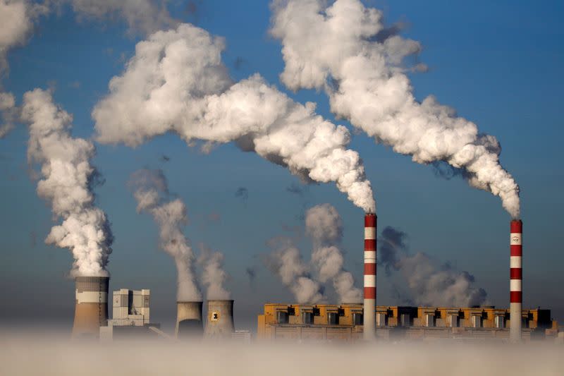 FILE PHOTO: Smoke billows from the chimneys of Belchatow power station in Poland