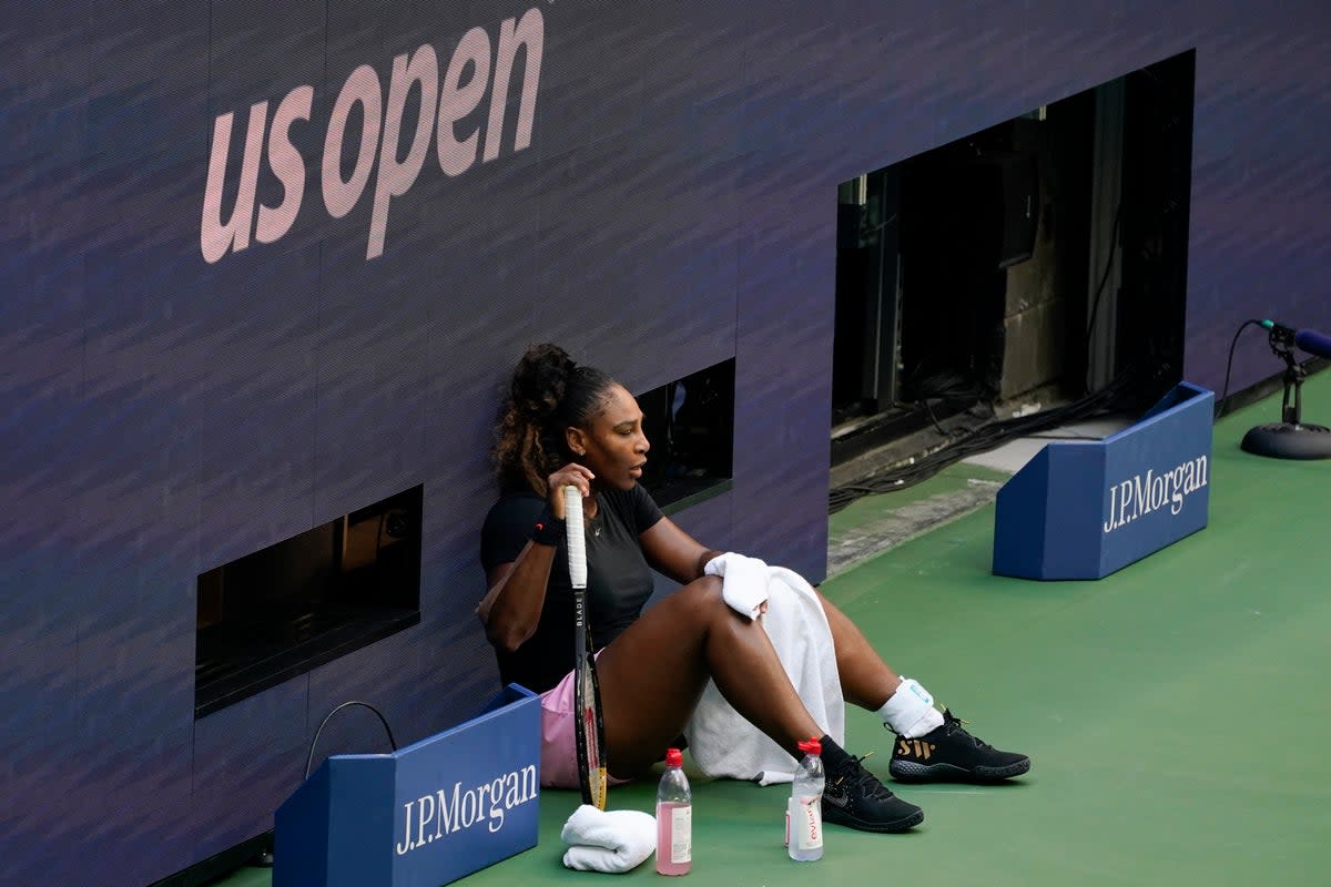 Serena Williams rests while practicing at Arthur Ashe Stadium before the start of the U.S. Open tennis tournament in New York, Thursday, Aug. 25, 2022. (AP Photo/Seth Wenig) (AP)