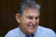 Sen. Joe Manchin, D-W.Va., prepares to chair a hearing in the Senate Energy and Natural Resources Committee, as lawmakers work to advance the $1 trillion bipartisan bill, at the Capitol in Washington, Thursday, Aug. 5, 2021. (AP Photo/J. Scott Applewhite)