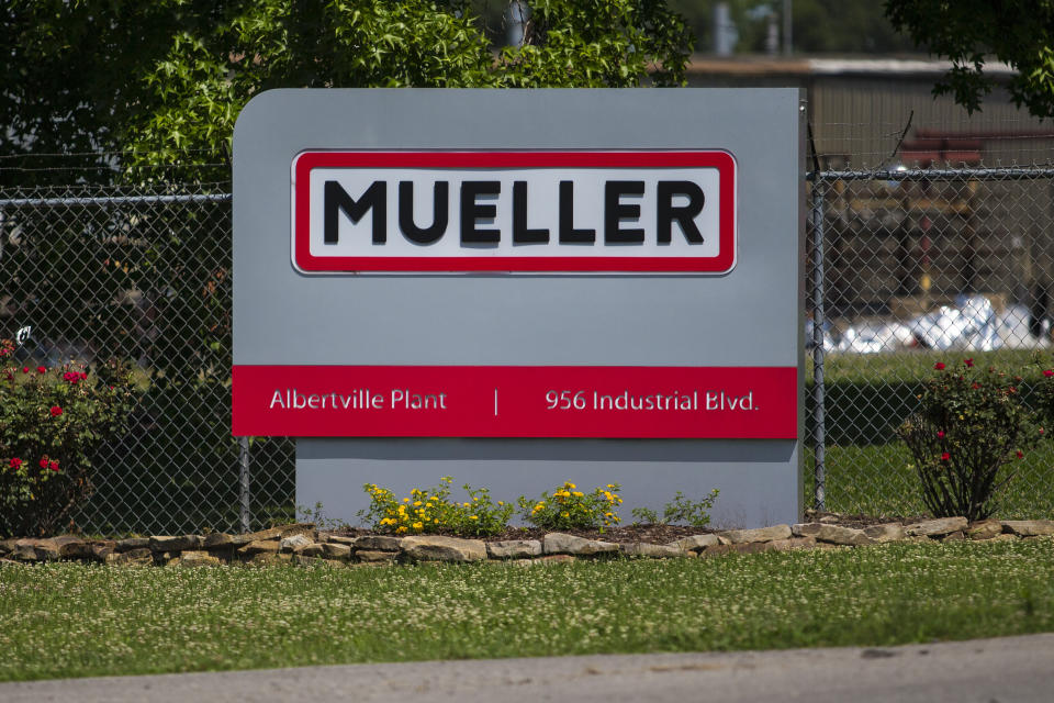 A sign for Mueller Co. is displayed at the entrance to the fire hydrant plant where police said multiple people were shot to death and others were wounded in Albertville, Ala., on Tuesday, June 15, 2021. (AP Photo/Vasha Hunt)