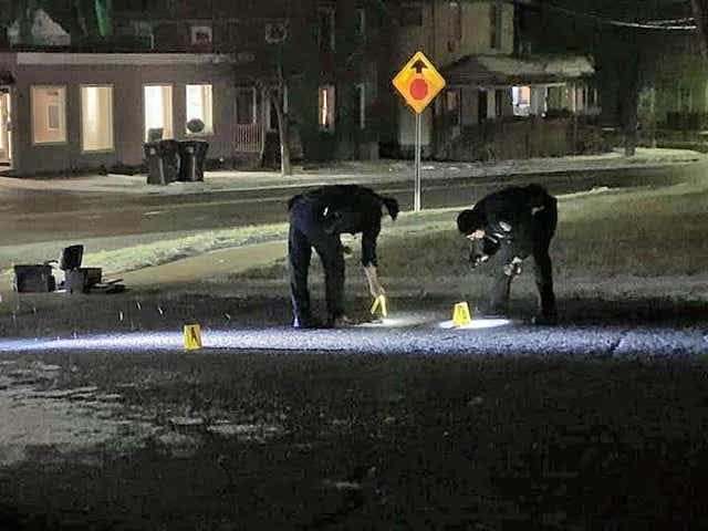 Hillsdale City Police Officers process the scene of a shooting January 19, 2021, outside the Hillsdale Community Library.