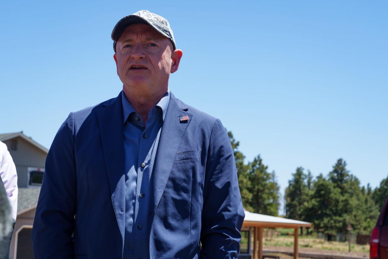 Sen. Mark Kelly speaks to the press about flood mitigation plans in the Wupatki Trails neighborhood on May 25, 2023, in Flagstaff, Ariz.