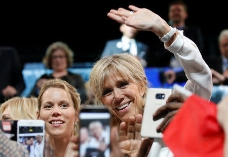 Brigitte Trogneux (R), wife of Emmanuel Macron, head of the political movement En Marche !, or Onwards !, and candidate for the 2017 presidential election, and her daughter Tiphaine attend a political rally in Paris, France, April 17, 2017. REUTERS/Christian Hartmann