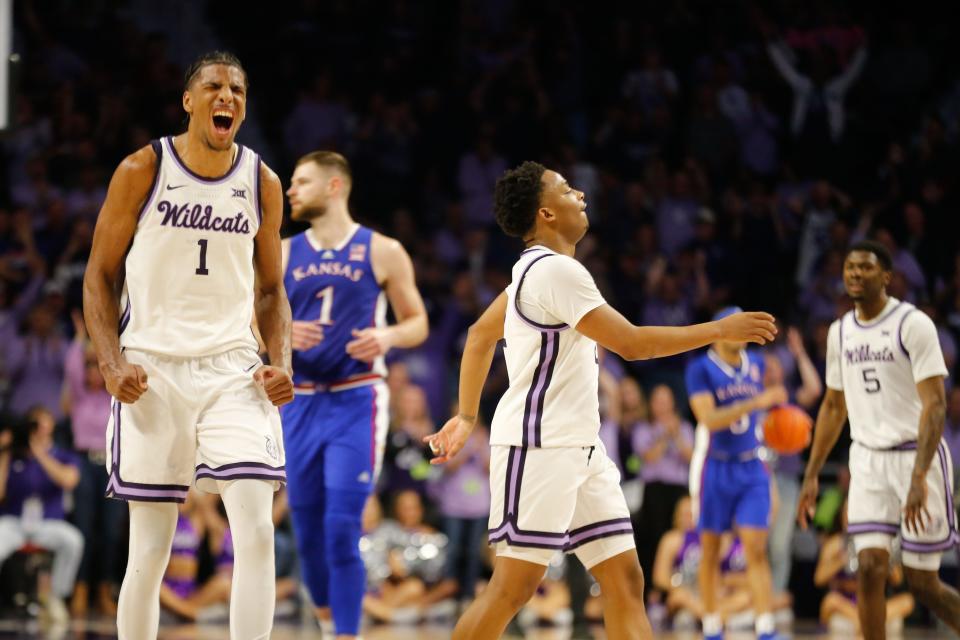 Kansas senior forward David N'Guessan (1) reacts alongside graduate senior guard Tylor Perry (2) after gaining a lead in the second half of the Sunflower Showdown inside Bramlage Coliseum Monday, February 5, 2024.